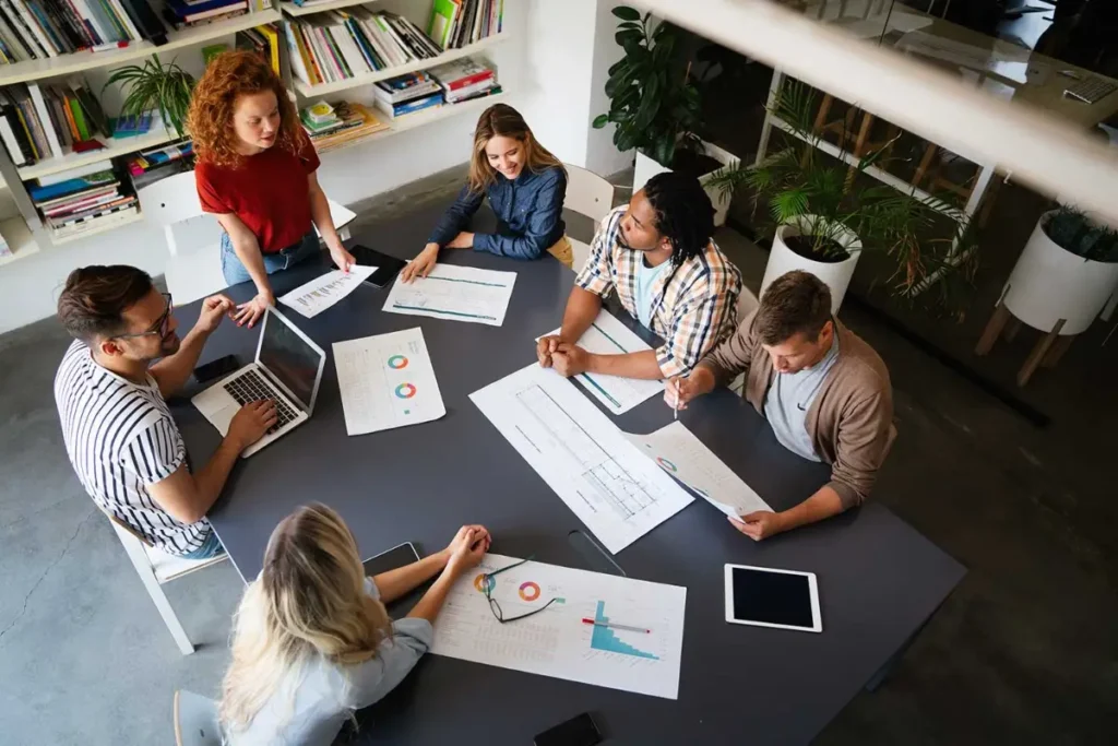 business team reviewing data and discussing growth strategy in office